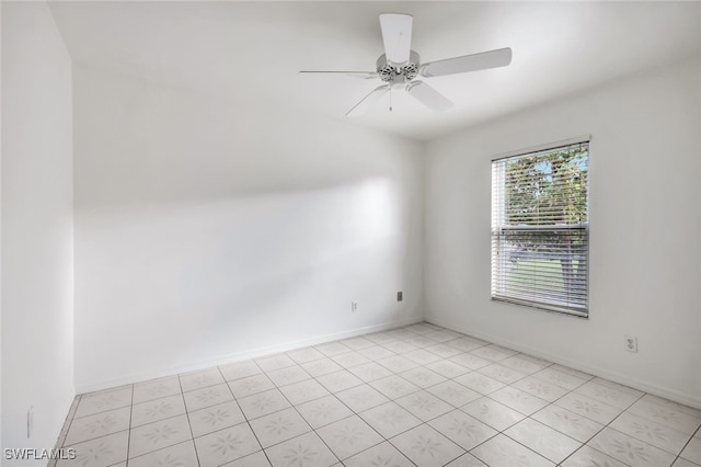 unfurnished room with light tile patterned floors and ceiling fan