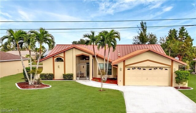 view of front of property with a garage and a front lawn