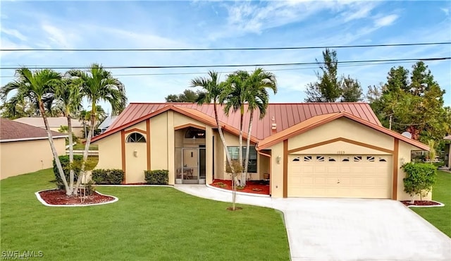 view of front of home with a garage and a front yard