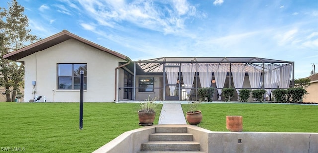 exterior space featuring a front lawn and glass enclosure