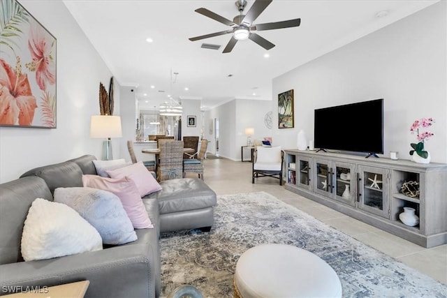 tiled living room with ceiling fan