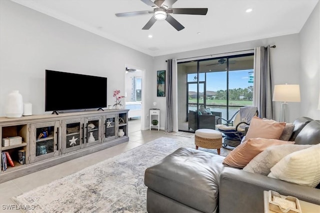 tiled living room with ceiling fan