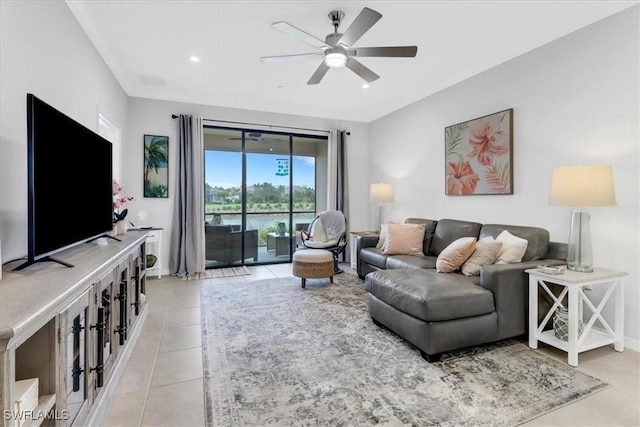 living room with ceiling fan and light tile patterned flooring