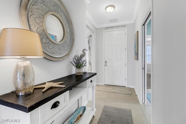 tiled entrance foyer with ornamental molding