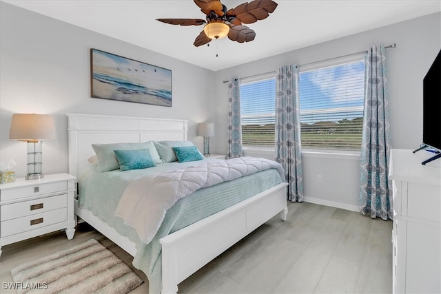 bedroom featuring ceiling fan and light hardwood / wood-style flooring