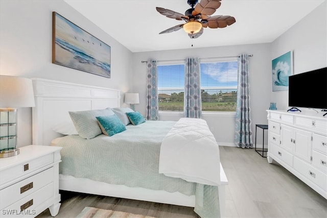 bedroom featuring ceiling fan and light hardwood / wood-style floors