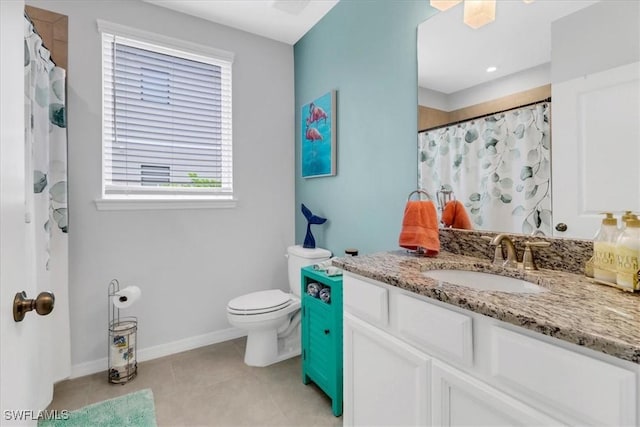 bathroom featuring toilet, vanity, tile patterned flooring, and a shower with curtain