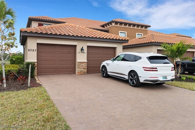 mediterranean / spanish house with a garage