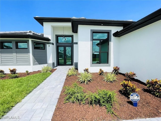 doorway to property featuring french doors