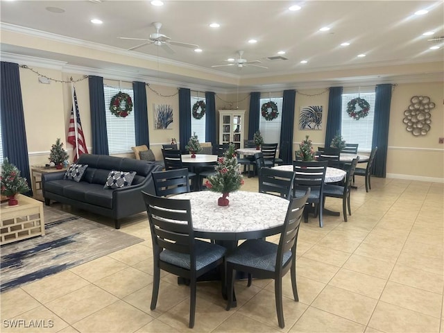 dining room with ceiling fan, light tile patterned floors, and crown molding