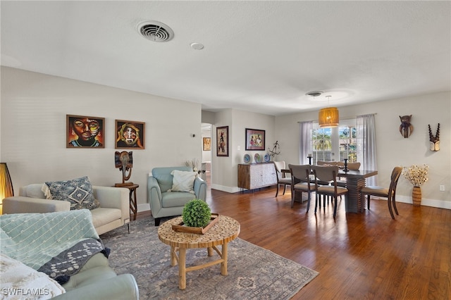 living room with dark wood-type flooring