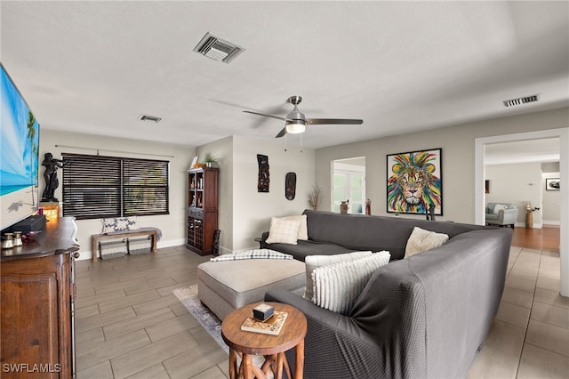 living room with ceiling fan