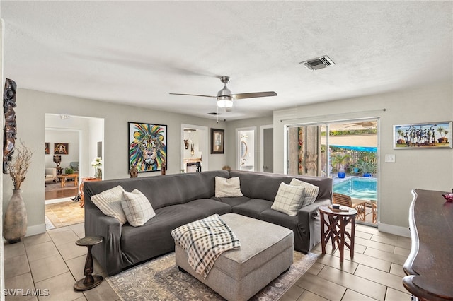 1262 Carlene Ave, Fort Myers, FL 33901 - living room with ceiling fan, baseboards, visible vents, and a textured ceiling