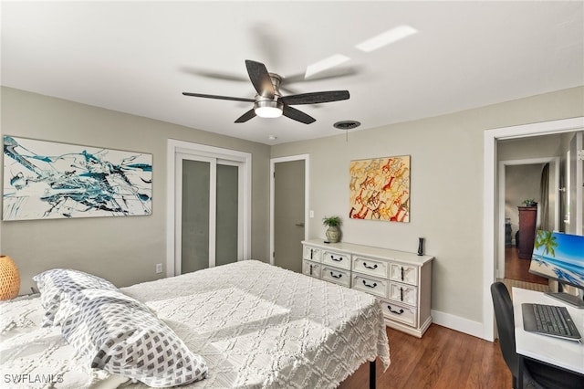 bedroom with ceiling fan and dark hardwood / wood-style flooring