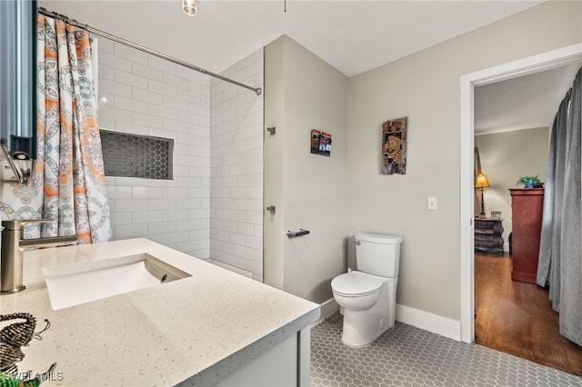 bathroom with toilet, tile patterned flooring, vanity, and a shower with shower curtain