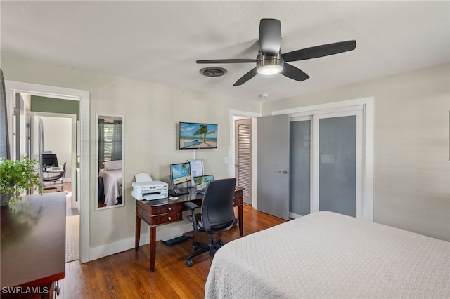 bedroom featuring dark wood-type flooring and ceiling fan