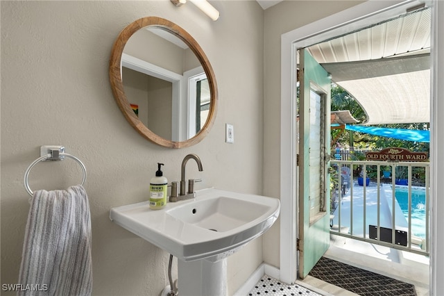 bathroom with sink and a wealth of natural light