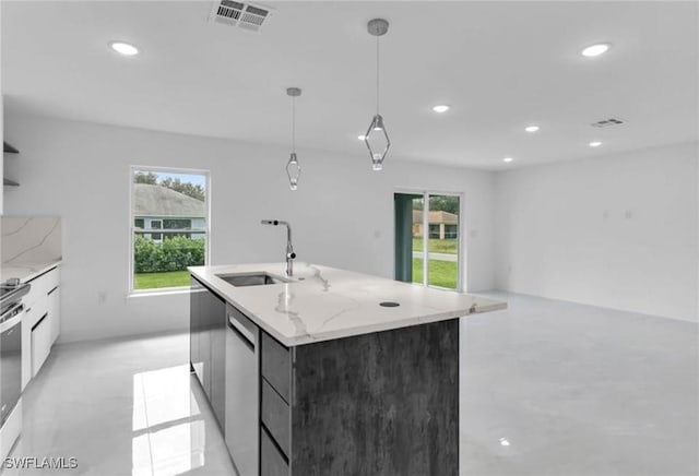 kitchen with sink, stainless steel dishwasher, an island with sink, decorative light fixtures, and white cabinetry