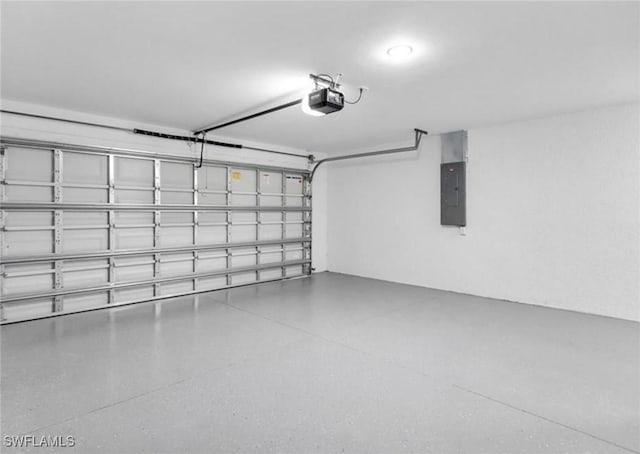 garage with electric panel and a garage door opener