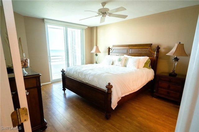 bedroom featuring access to outside, ceiling fan, and wood-type flooring