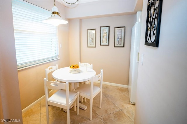 dining room with light tile patterned flooring