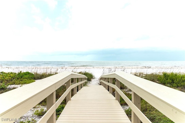 view of property's community featuring a view of the beach and a water view