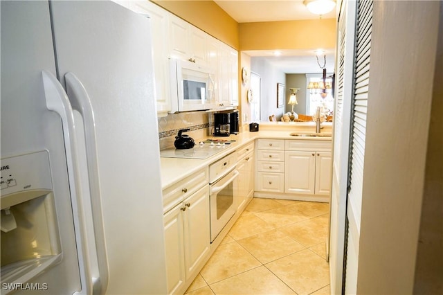 bathroom with tile patterned floors, vanity, and tasteful backsplash