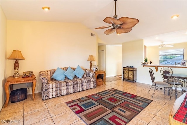 living room with lofted ceiling, ceiling fan, visible vents, and tile patterned floors