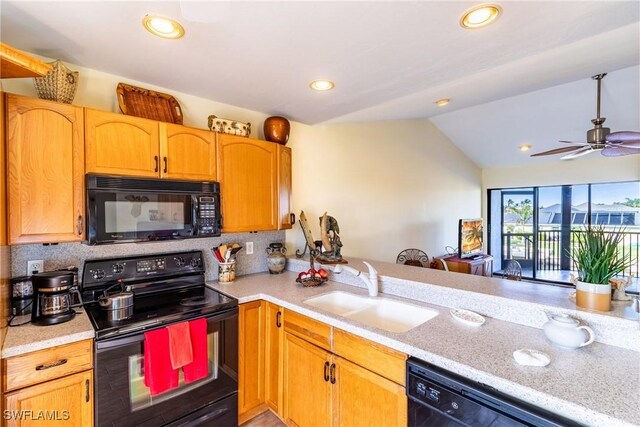 kitchen featuring ceiling fan, sink, kitchen peninsula, lofted ceiling, and black appliances