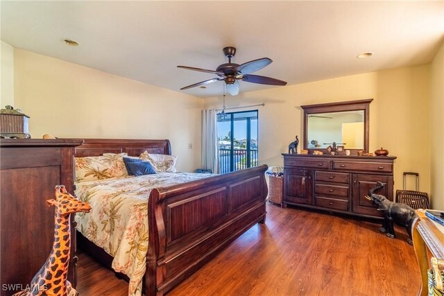 bedroom featuring ceiling fan and dark hardwood / wood-style flooring