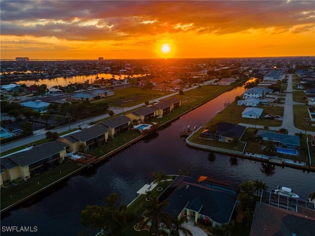 aerial view at dusk with a water view