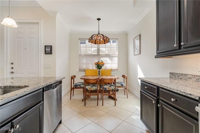 kitchen featuring light stone countertops, crown molding, pendant lighting, and stainless steel dishwasher