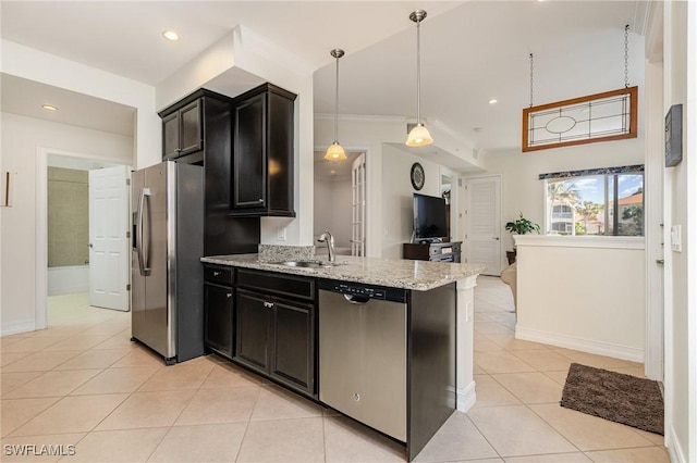 kitchen featuring sink, light tile patterned floors, light stone countertops, appliances with stainless steel finishes, and decorative light fixtures