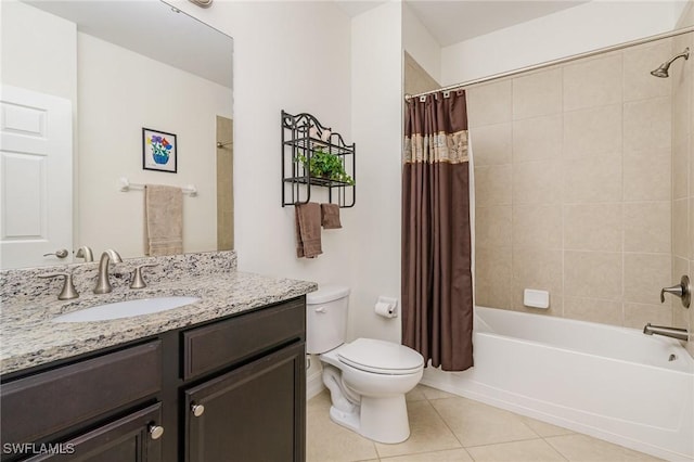 full bathroom featuring tile patterned floors, vanity, toilet, and shower / tub combo