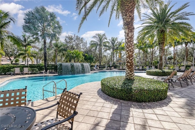 view of swimming pool featuring a patio area and pool water feature