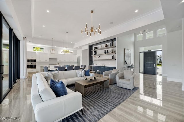 living room featuring a healthy amount of sunlight and an inviting chandelier