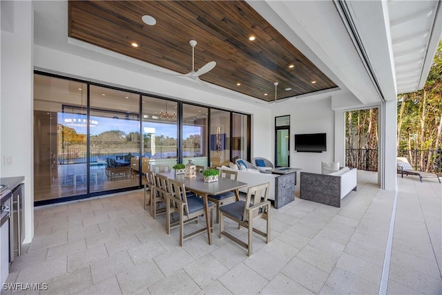 dining space with wood ceiling