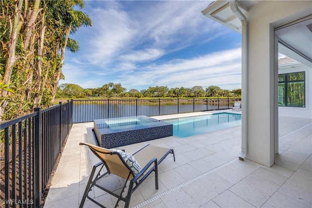 view of swimming pool with an in ground hot tub, a water view, and a patio area