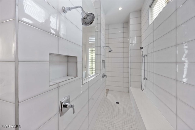 bathroom with tiled shower