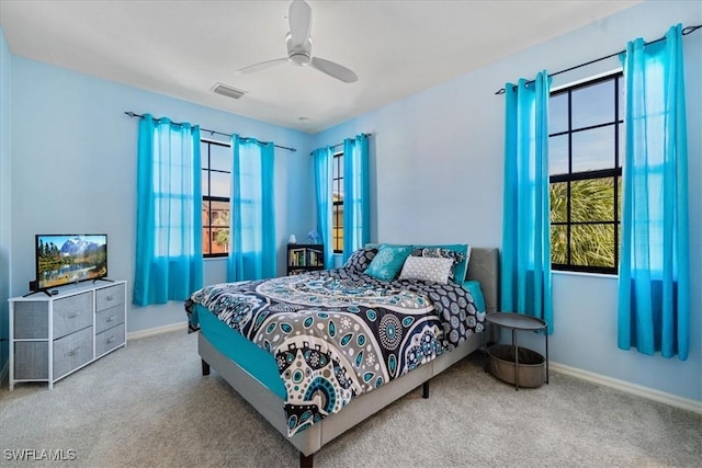 carpeted bedroom featuring ceiling fan