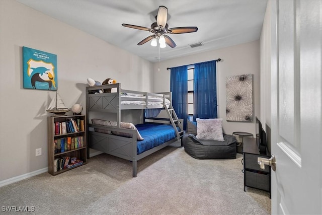 bedroom featuring ceiling fan and light carpet