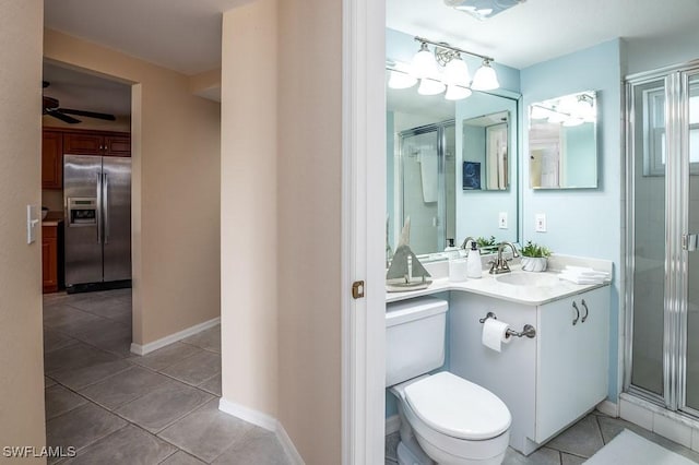 bathroom with toilet, a shower stall, a ceiling fan, and tile patterned floors