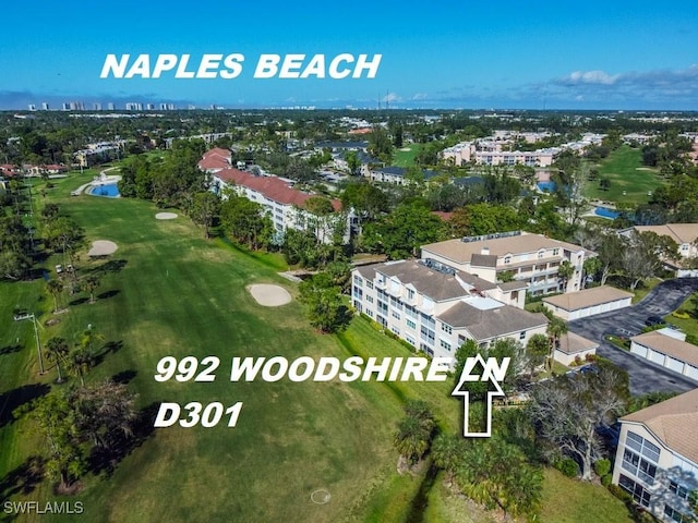 birds eye view of property with view of golf course