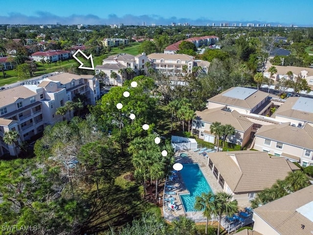 birds eye view of property with a residential view