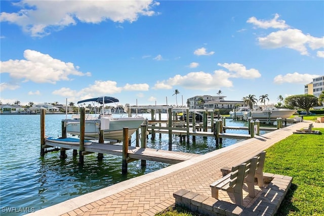 dock area with a water view and boat lift