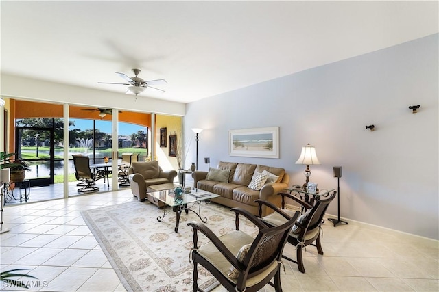 living room with ceiling fan and light tile patterned floors