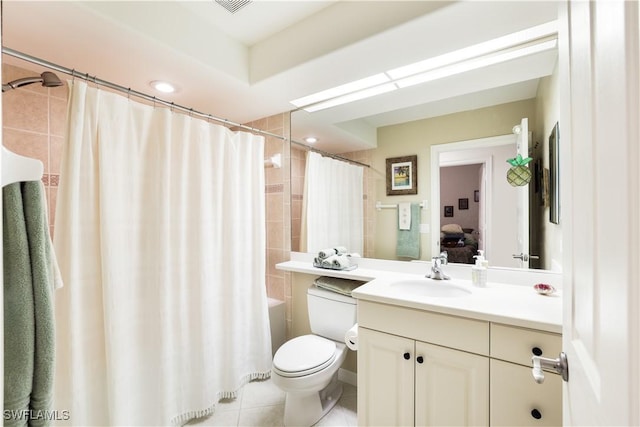 bathroom featuring toilet, vanity, and tile patterned floors