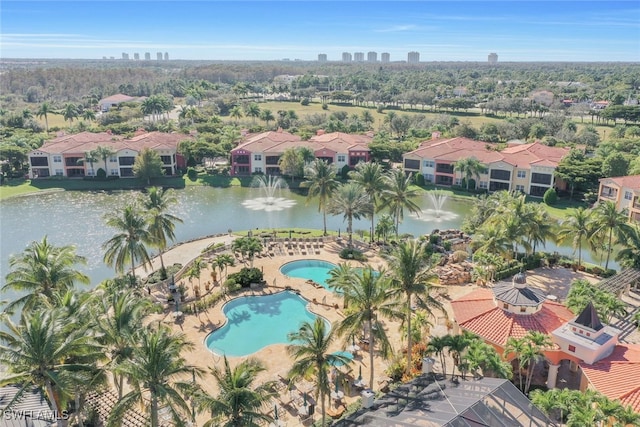 birds eye view of property with a water view