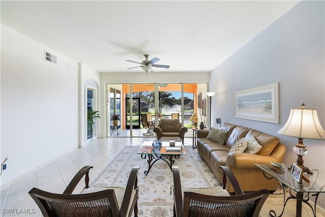 tiled living room with ceiling fan