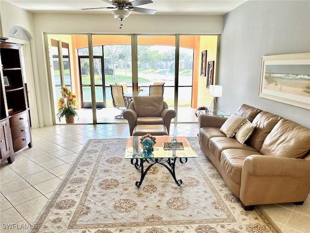 tiled living room with ceiling fan